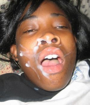 Ebony chick takes a huge cumshot on her face